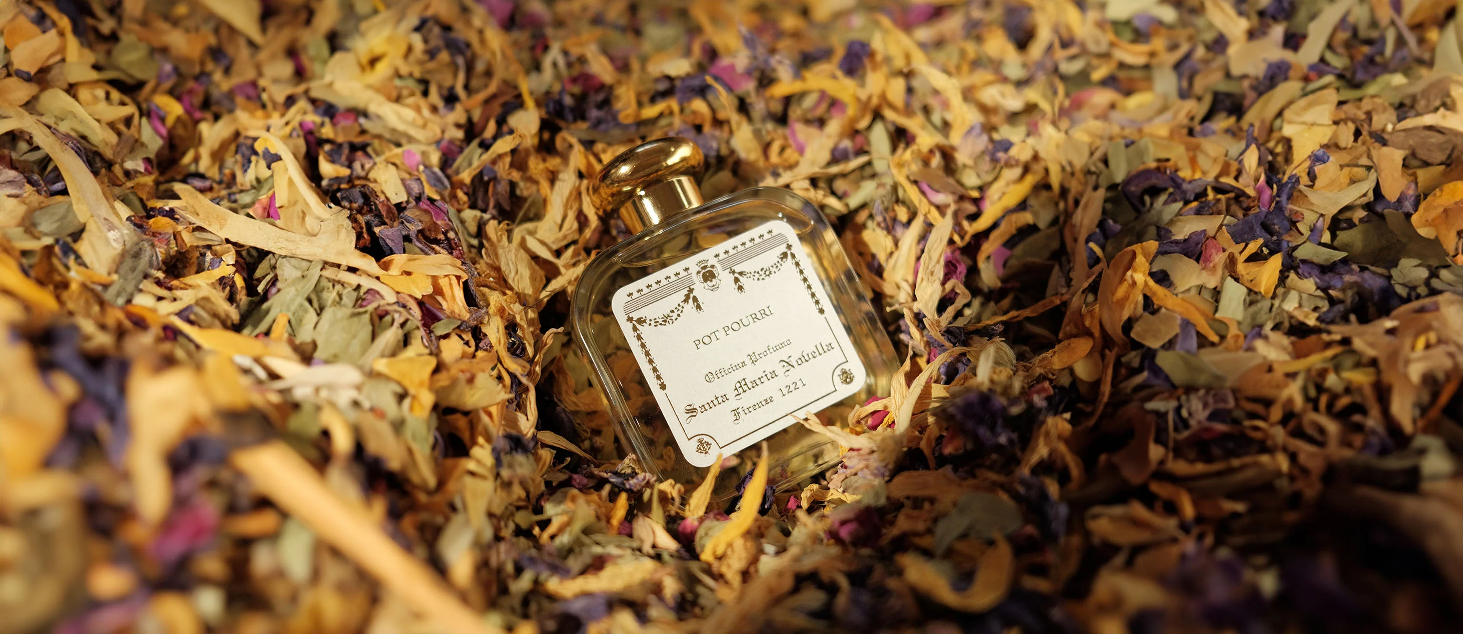 Perfume bottle in dried flowers